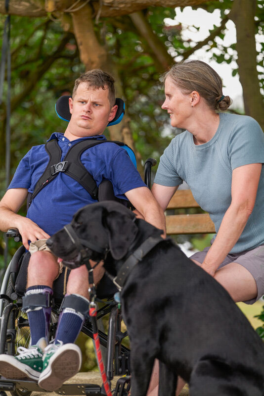 Callum enjoying the comfortable SPEX equipment as he goes for a ride with his dog