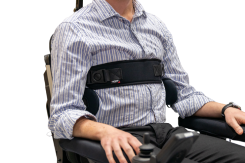 Man in wheelchair showing strapping options.