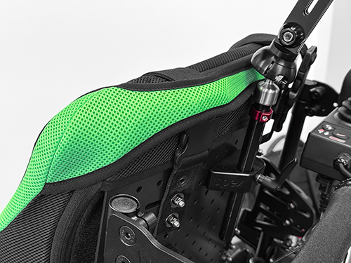 Close up image of the Manta Back support's inbuilt fabric harness retainer. Green Back support.