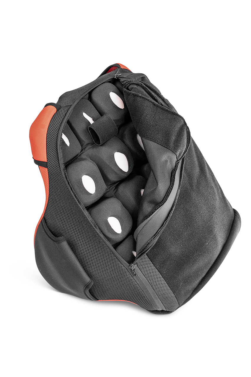 Image of the back of a red Manta Back support. Half of the cover is unzipped, showcasing the contouring underneath.