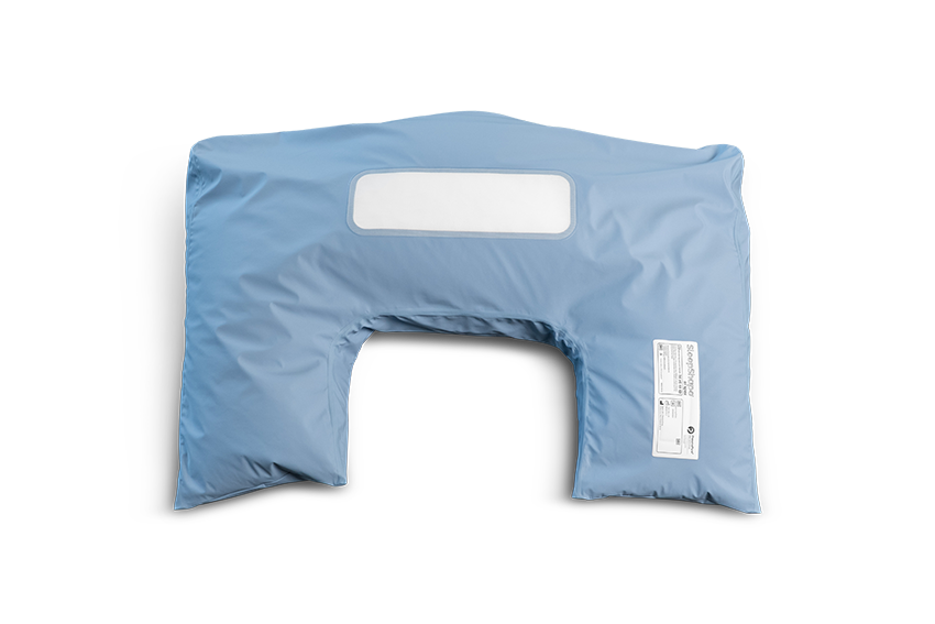 Birds eye view of blue SleepShape semi fowler cushion shown with hygienic cover.