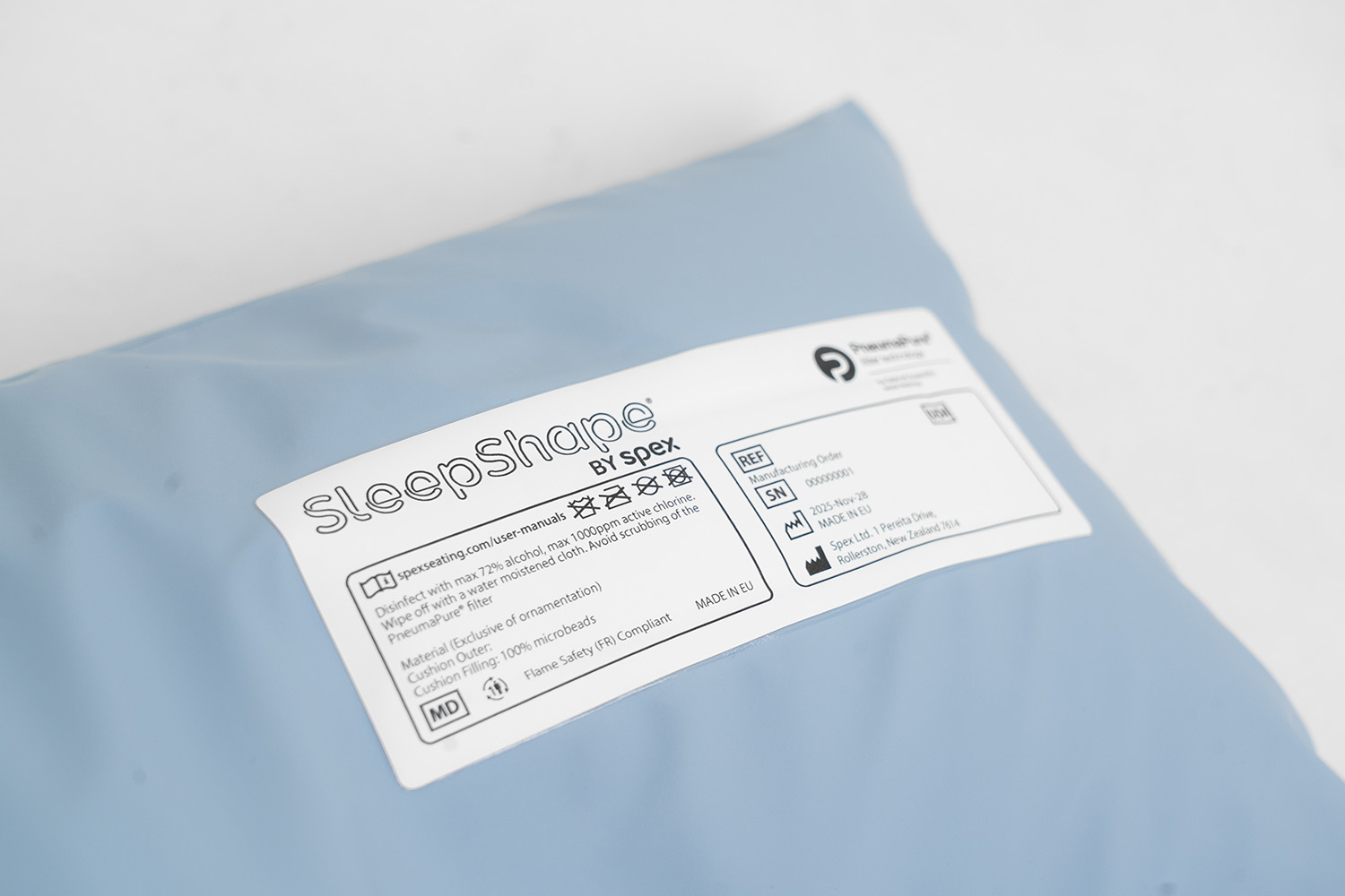 Close up image of the white Sleepshape by Spex label on the positioning cushion.